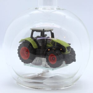 Magicflasche Claas-Traktor 200 ml Eine leere bauchige Flasche aus Glas mit einem Claas-Traktor im Inneren.